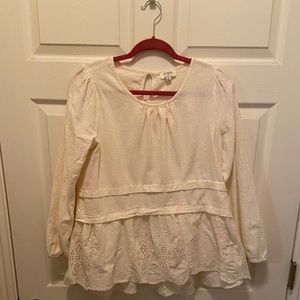 Three-quarter sleeved linen eyelet peplum top
